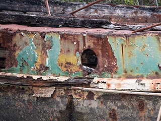 porthole in abandoned barge