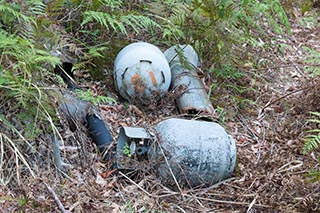 Old propane tanks dumped in the bush near Wondabyne, Australia