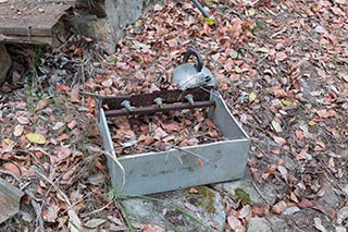 Broken stove and kettle dumped in the bush near Wondabyne, Australia
