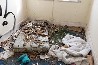 Filthy mattress on floor in St. John's Orphanage