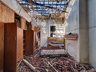 Fire damaged bedroom in St. John's Orphanage