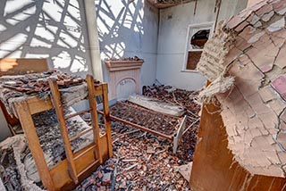 Fire damaged bedroom in St. John's Orphanage