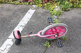 Unicycle dumped in front of Burnt Out Wedding Venue