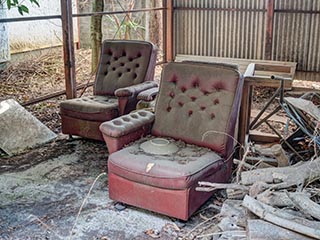 Old chairs in carport at Car Hotel Mangetsu