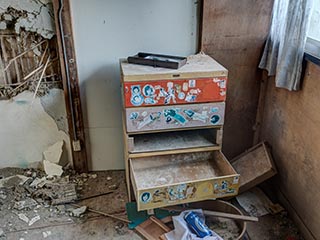 Broken chest of drawers in abandoned Japanese house