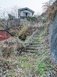 Stairs leading to abandoned house
