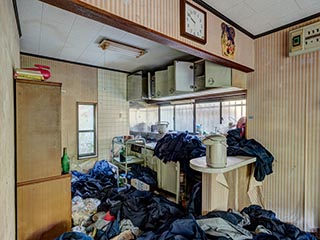 Abandoned house full of school uniforms