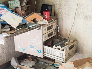Cluttered desk in abandoned Japanese house