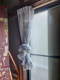Knotted curtain in abandoned Japanese house