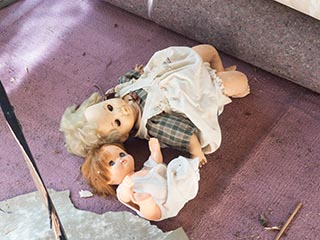 Dolls lying on floor