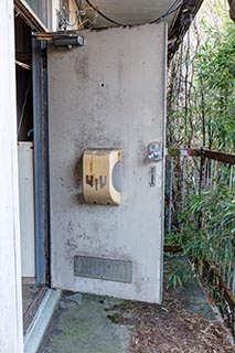 Door of abandoned apartment, Kanagawa Prefecture, Japan