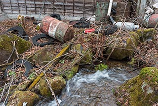 Garbage by Small Japanese Mountain Stream