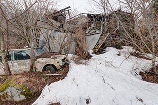 Abandoned Car and Collapsing Building