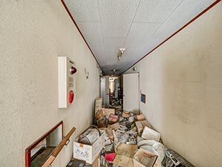Garbage filled corridor in Hotel Bluebird
