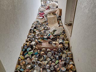 Floor covered in empty cans