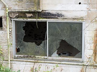 Broken window of Hotel Bluebird