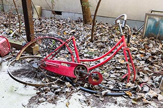Bicycle dumped at abandoned love hotel Century