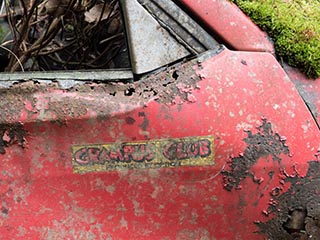 Sticker on abandoned Mazda