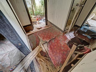 Collapsed entry hall floor in Motel Sun River