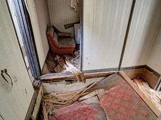 Collapsed entry hall floor in Motel Sun River