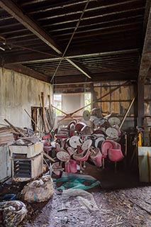 Pile of Pachinko Chairs in Abandoned Building in Murayama, Japan
