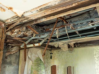 Collapsing ceiling of Queen Château Soapland guest room