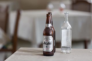 Bottles on Table in Abandoned Sun Park Hotel