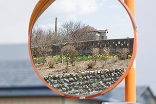 Abandoned Tamura Iron Manufacturing Office Reflected in Roadside Mirror