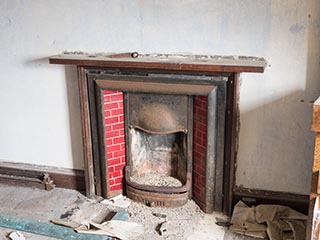 bedroom fireplace in abandoned house