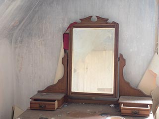 mirror in bedroom of abandoned house