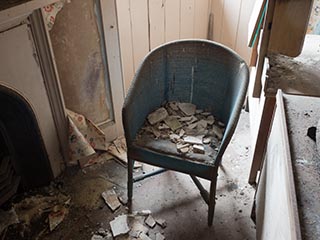 chair covered in broken plaster