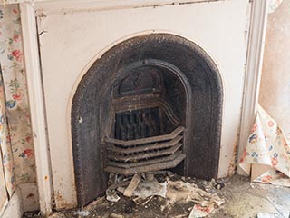 bedroom fireplace in abandoned house