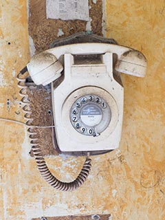 old telephone in abandoned house