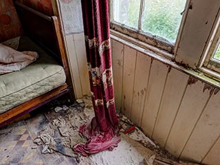 old curtain and filthy floor