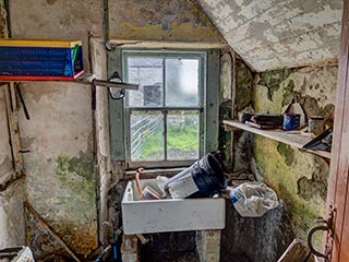 filthy kitchen in abandoned house