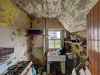 filthy kitchen in abandoned house