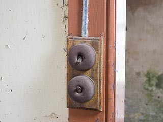 old-fashioned light switches in abandoned house