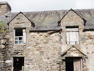 front windows of ruined house