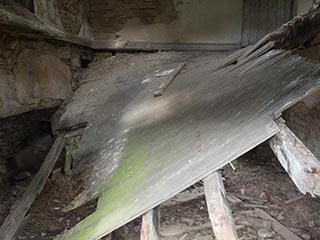 collapsed floor of ruined house