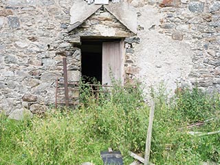 front door of ruined house