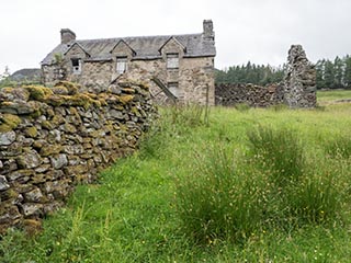 dry stone wall and abandoned house