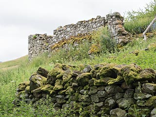 dry stone wall and ruined building