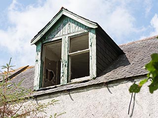 dormer window of abandoned house