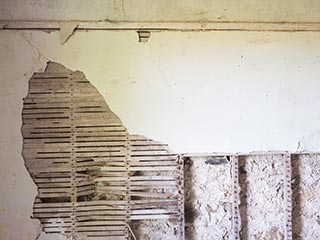 damaged wall in abandoned house