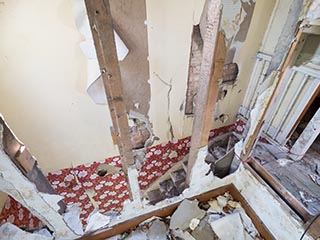 broken wall above stairs