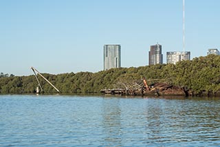 wreck of SS Heroic with buildings in distance