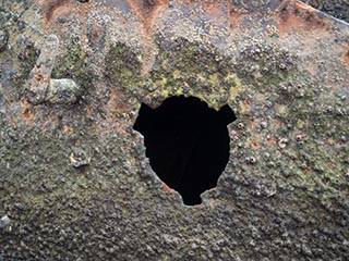 empty porthole on SS Heroic