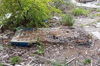 Rotting mattress outside St. John's Orphanage