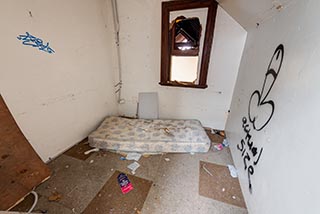 Small room behind stairs in St. John's Orphanage