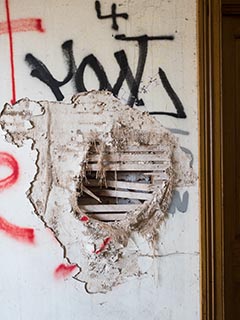 Damaged wall in St. John's Orphanage